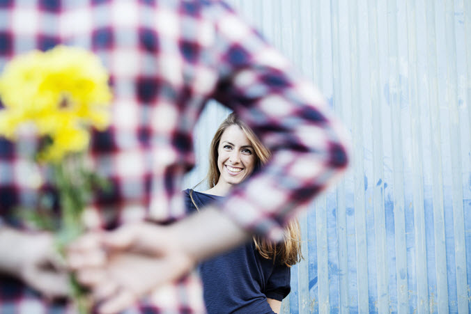 man with flowers for woman